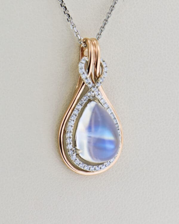 custom rose gold pear pendant with blue moonstone and diamonds 4
