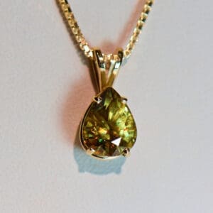 greenish yellow sphene pear solitaire pendant in gold