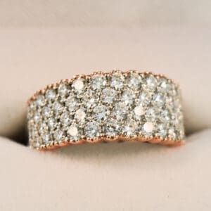 impressive custom pave diamond band in white and rose gold
