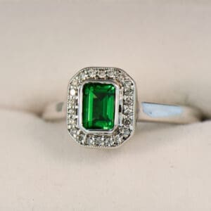 tsavorite and diamond emerald cut halo ring