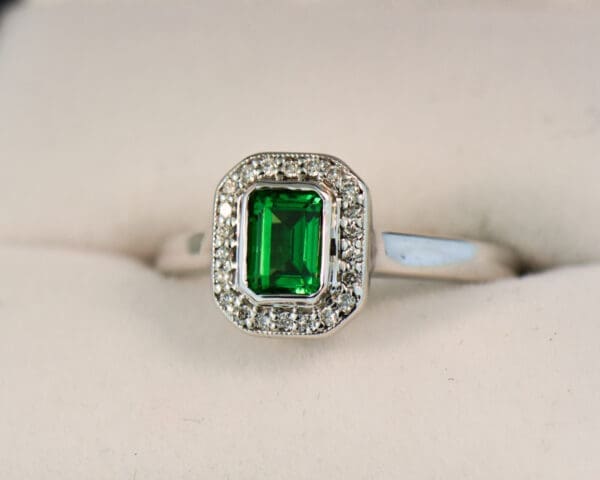 tsavorite and diamond emerald cut halo ring