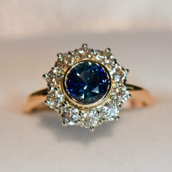 antique yellow gold halo engagement ring set with teal sapphire and diamonds 4