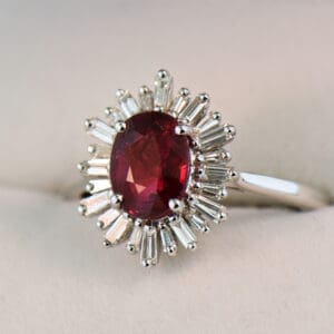 2ct oval ruby engagement ring with baguette diamond halo