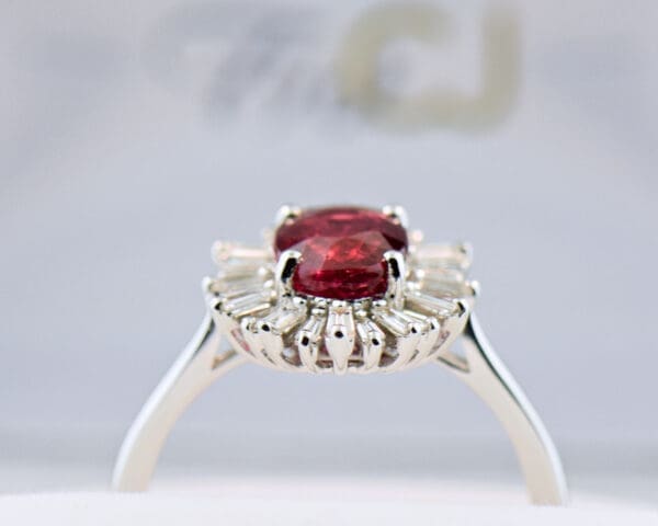 2ct oval ruby engagement ring with baguette diamond halo 2