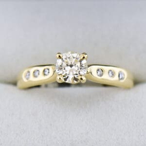 natural diamond engagement ring in classic yellow gold setting