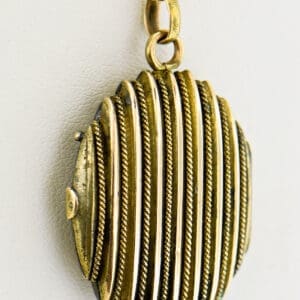 oval gold striped locket with rope trim