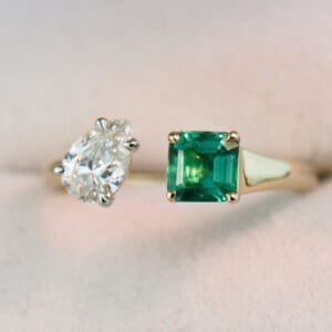 pear diamond and square emerald two stone ring