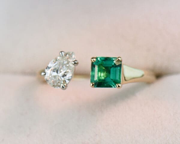pear diamond and square emerald two stone ring