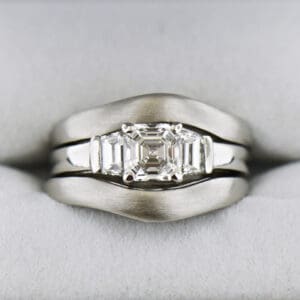 platinum wedding set with asscher cut diamond trapezoid accents and framing bands