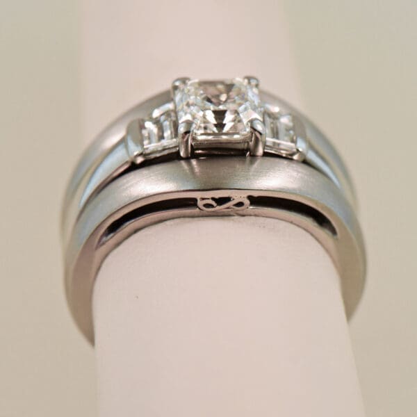platinum wedding set with asscher cut diamond trapezoid accents and framing bands 3