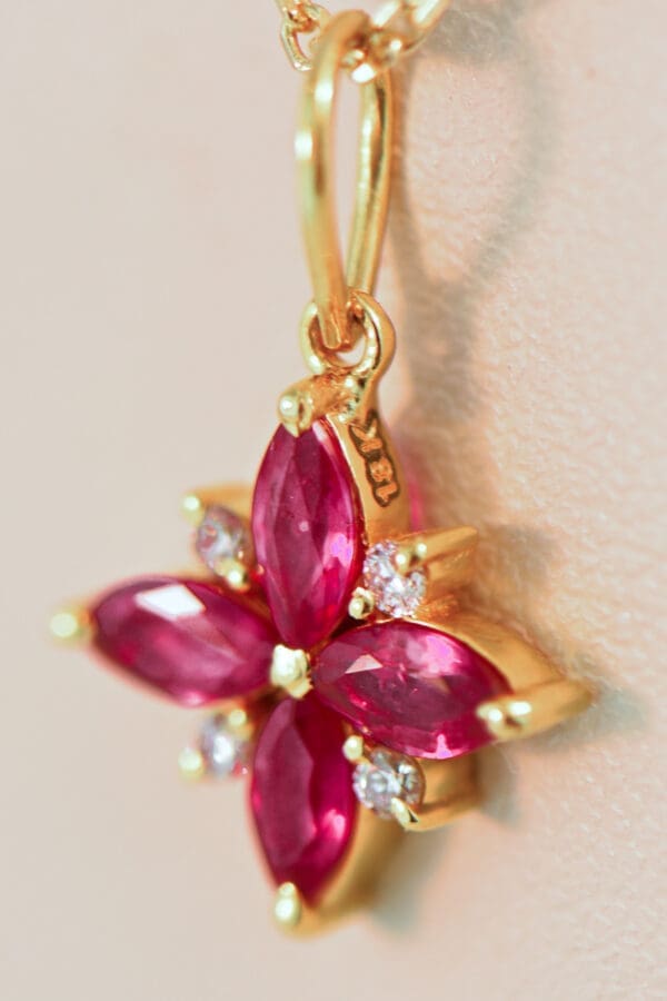 ruby clover pendant with diamond accents in 18k gold 2