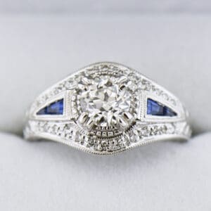 vintage style ring with old european cut diamond center and sapphire accents 2