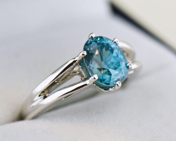 custom blue zircon ring with white gold split shank 2