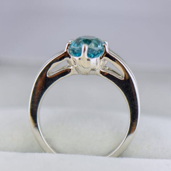 custom blue zircon ring with white gold split shank 3