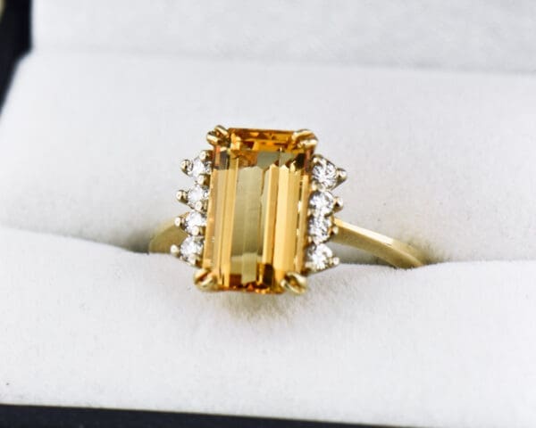 emerald cut imperial topaz engagement ring