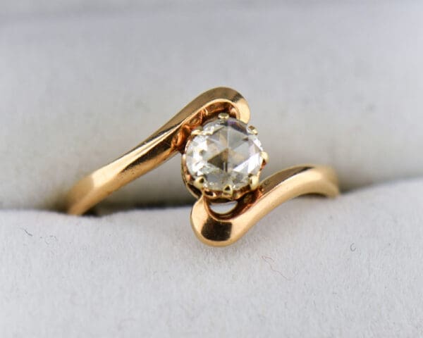 rose cut diamond and rose gold antique bypass engagement ring