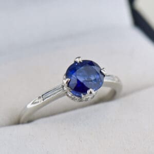 art deco platinum blue sapphire engagement ring with baguette diamonds
