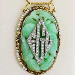 french art deco carved jade and diamond monogram pendant