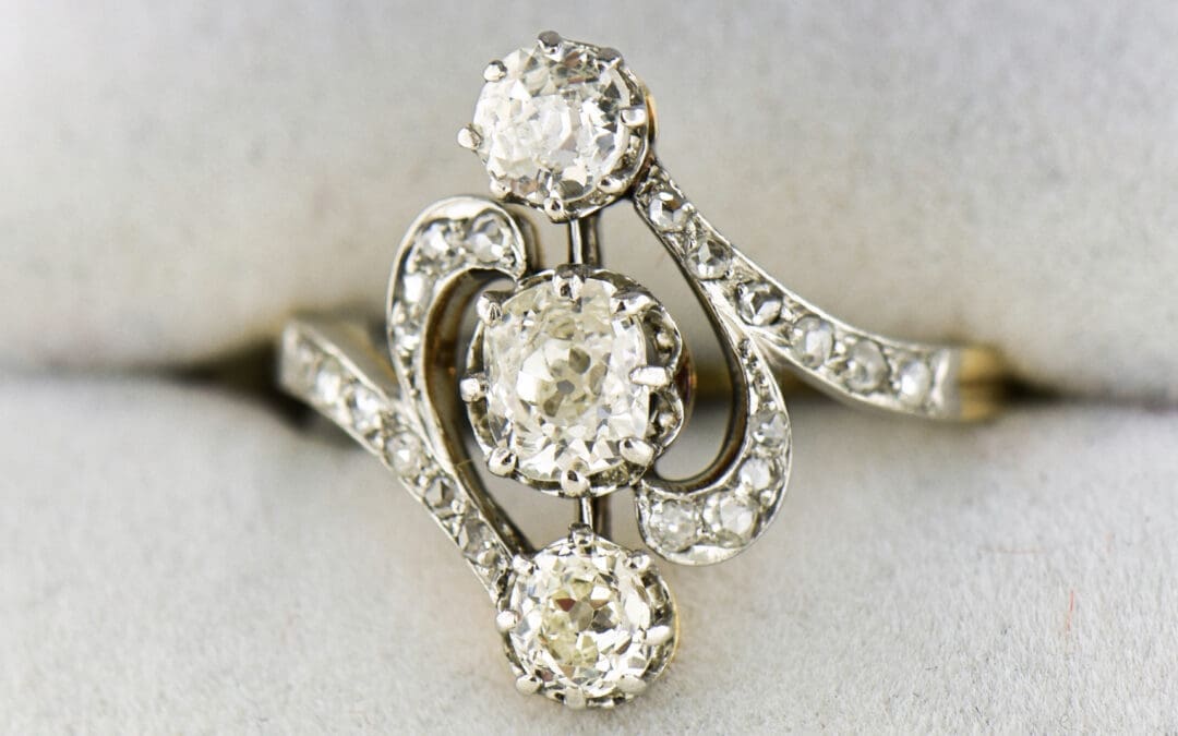 art nouveau french platinum topped gold ring with three old mine cut diamonds