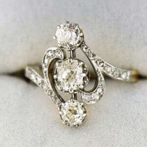 art nouveau french platinum topped gold ring with three old mine cut diamonds