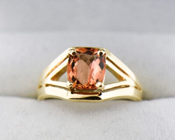 cushion peach pink imperial topaz and gold split shank solitaire ring