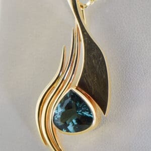 custom freeform gold pendant with teal tourmaline