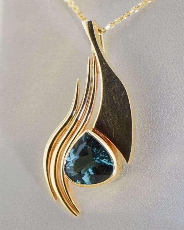 custom freeform gold pendant with teal tourmaline