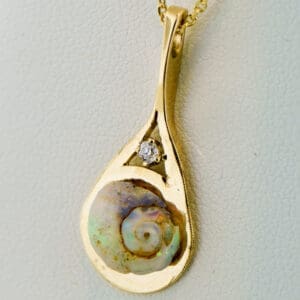 fossil opal snail set on gold pendant rare australian fossil opal