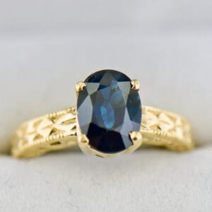 navy blue 2ct oval sapphire carved gold solitaire engagement ring