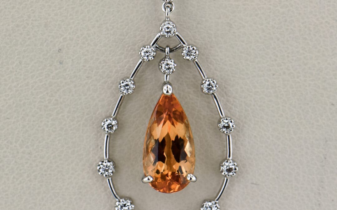 platinum diamond and pear shape imperial topaz pendant