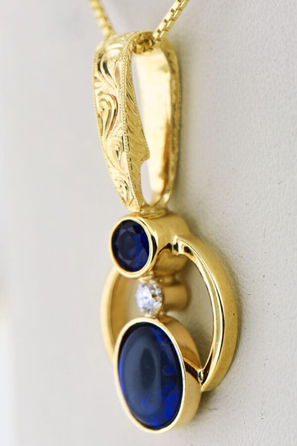 amazing custom gold pendant with blue black opal and blue sapphire 2