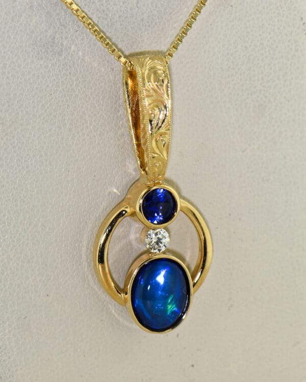 amazing custom gold pendant with blue black opal and blue sapphire 4