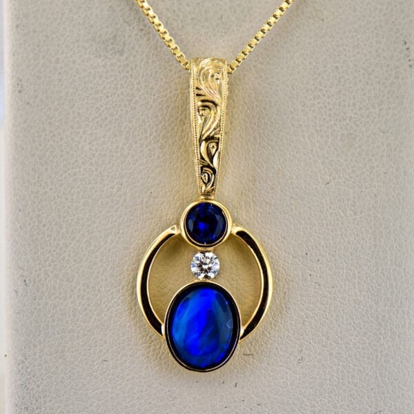 amazing custom gold pendant with blue black opal and blue sapphire 5