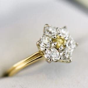 antique diamond flower cluster ring with yellow diamond and old euro halo