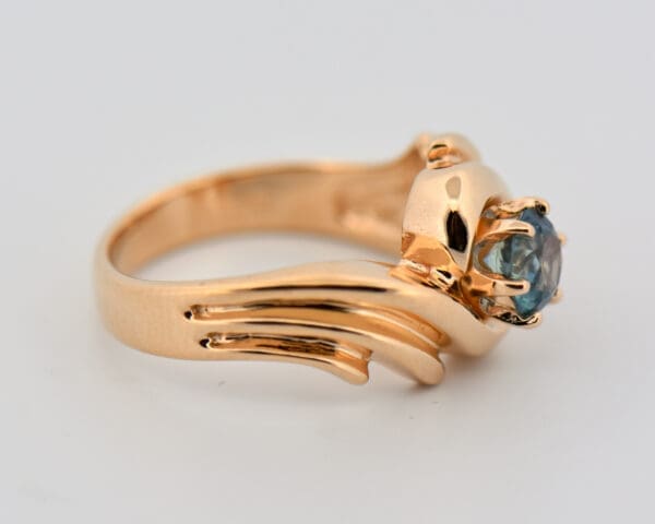 custom yellow gold swirl ring with teal montana sapphire 3