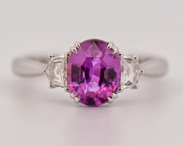 magenta purple sapphire and cadillac diamond three stone ring