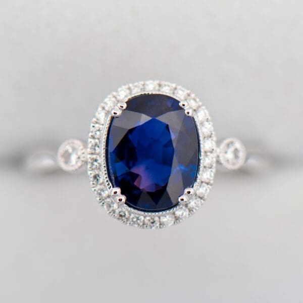 oval halo engagement ring with rare blue purple sapphire 2