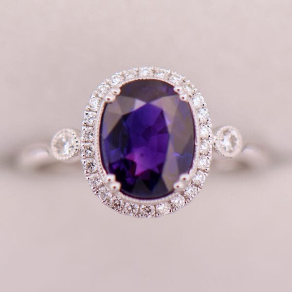 oval halo engagement ring with rare blue purple sapphire 3