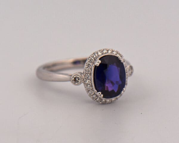 oval halo engagement ring with rare blue purple sapphire 5