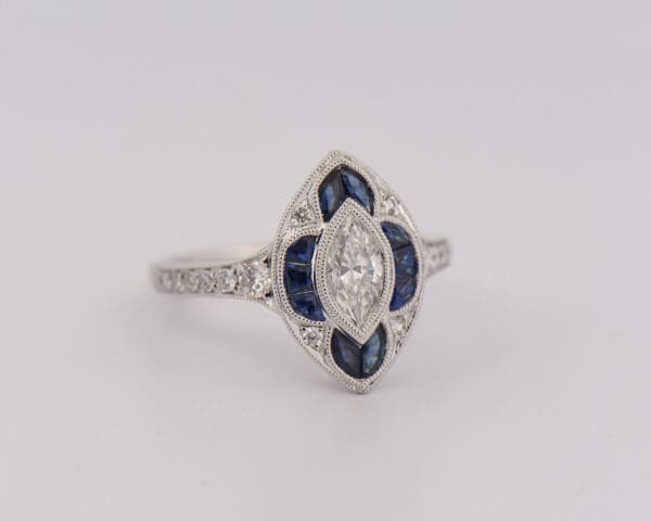 art deco style navette ring with marquise diamond and calibre sapphires 3