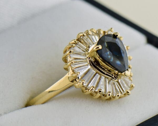 dark blue pear shape sapphire and baguette diamond ballerina ring 2