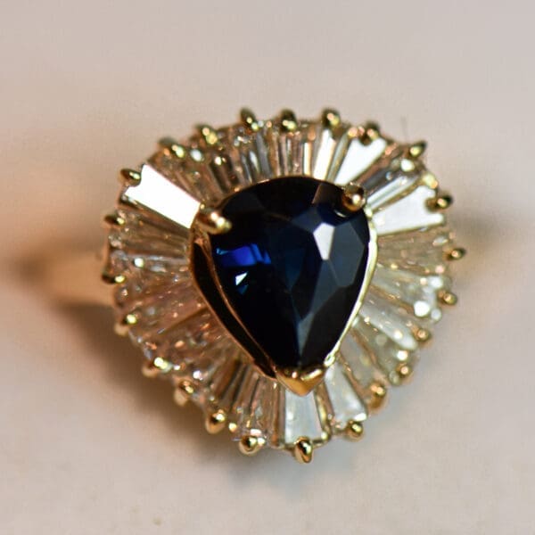 dark blue pear shape sapphire and baguette diamond ballerina ring 4