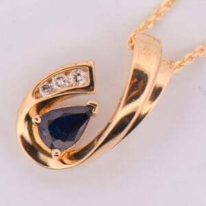 estate yellow gold navy blue sapphire and diamond pendant and earring set