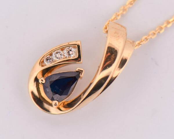 estate yellow gold navy blue sapphire and diamond pendant and earring set