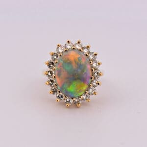 huge yellow gold opal and diamond halo cocktail ring