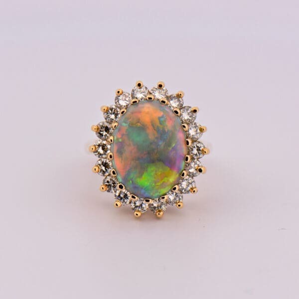 huge yellow gold opal and diamond halo cocktail ring