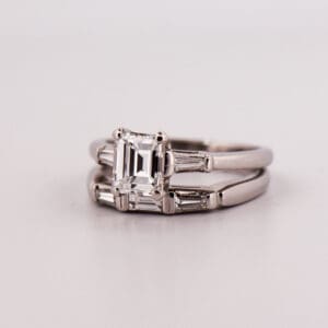 mid century platinum and diamond wedding set with emerald cut diamond center