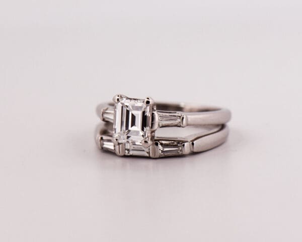 mid century platinum and diamond wedding set with emerald cut diamond center