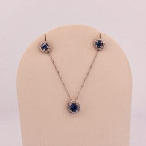 montana blue yogo sapphire and diamond halo pendant and earring set