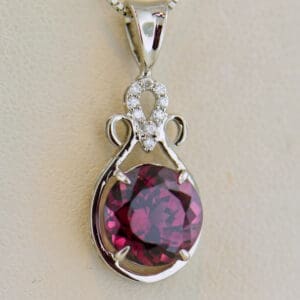 raspberry red rhodolite garnet and diamond pendant